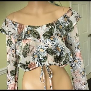 Sexy floral top sits above belly button